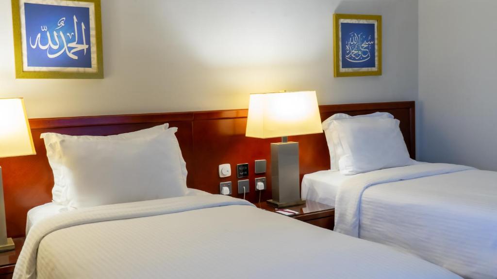 Postel nebo postele na pokoji v ubytování فندق الصفوة البرج الثالث Al Safwah Hotel Third Tower 3