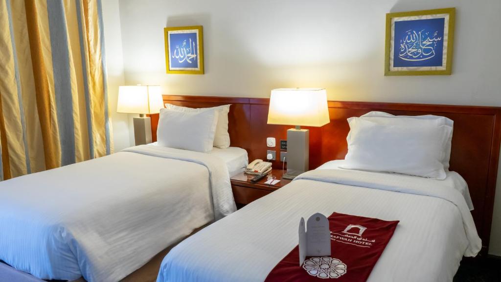 Postel nebo postele na pokoji v ubytování فندق الصفوة البرج الثالث Al Safwah Hotel Third Tower 3