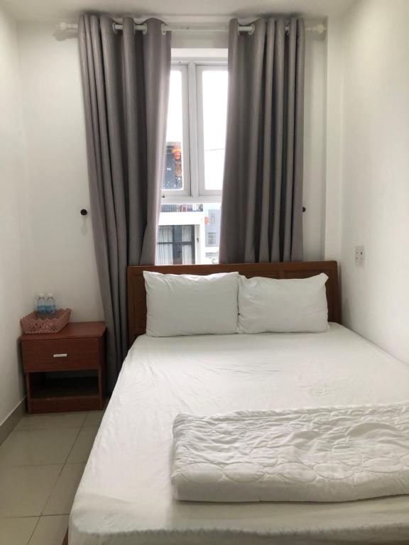 Postel nebo postele na pokoji v ubytování Motel Minh Thảo
