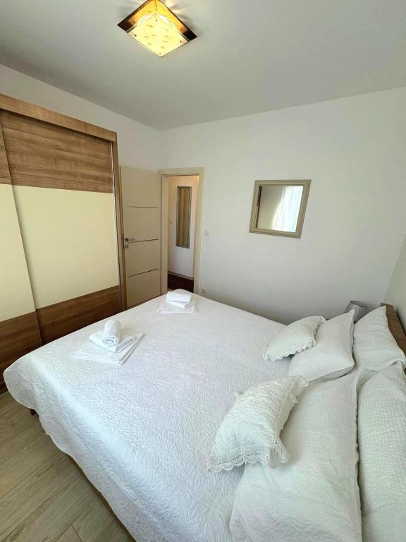 Posteľ alebo postele v izbe v ubytovaní Apartment Mišić
