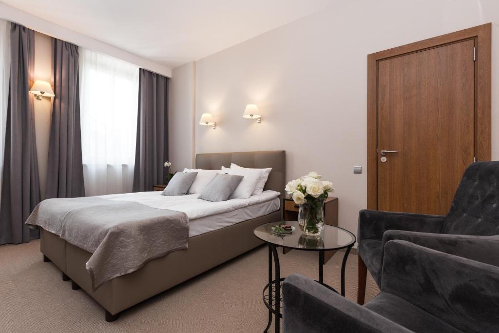 Posteľ alebo postele v izbe v ubytovaní Grottger Luxury Boutique Hotel City