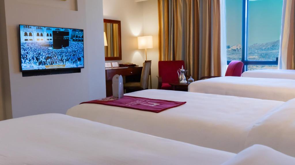 Postel nebo postele na pokoji v ubytování فندق الصفوة البرج الثالث Al Safwah Hotel Third Tower 3