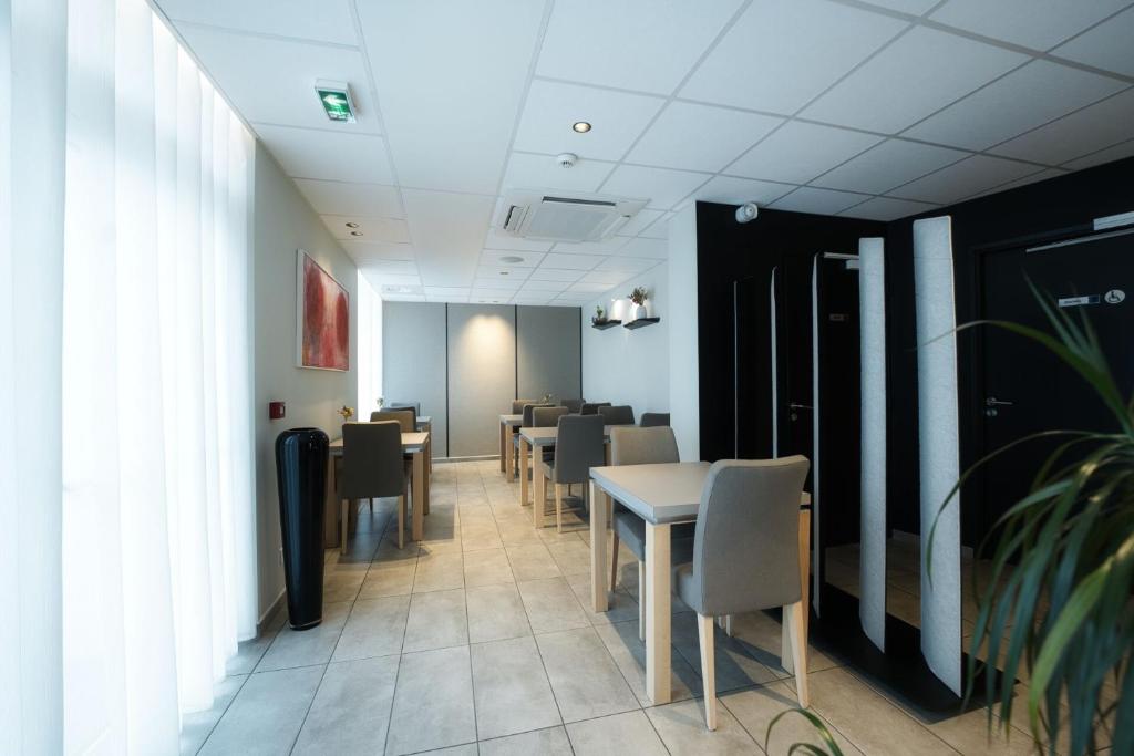 Posezení v ubytování Logis Restaurant & Hôtel À la 12