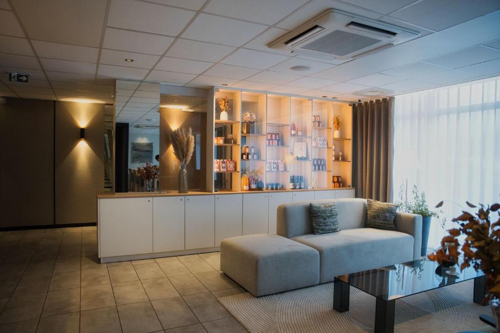 Posezení v ubytování Logis Restaurant & Hôtel À la 12