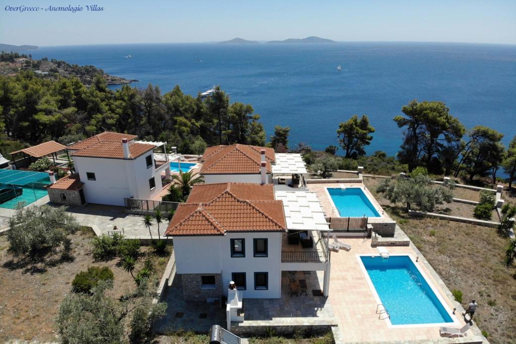 an aerial view of a house with two swimming pools at Villa Ostria in Alonnisos Old Town