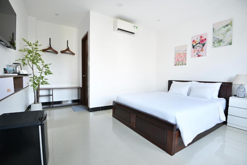 Postel nebo postele na pokoji v ubytování Horizon Côn Đảo Hotel
