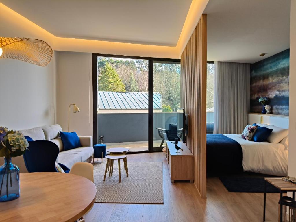 Un pat sau paturi într-o cameră la Apartamento Hortensia Diseño Exclusivo