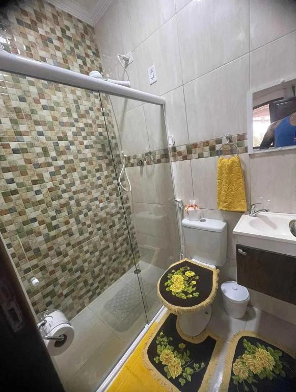 a bathroom with a shower and a toilet and a sink at Temporada2 in Olinda