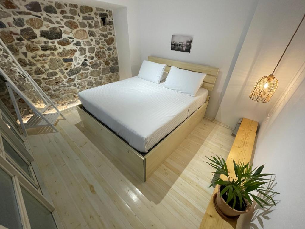 Postel nebo postele na pokoji v ubytování FOTEINI RESIDENCE