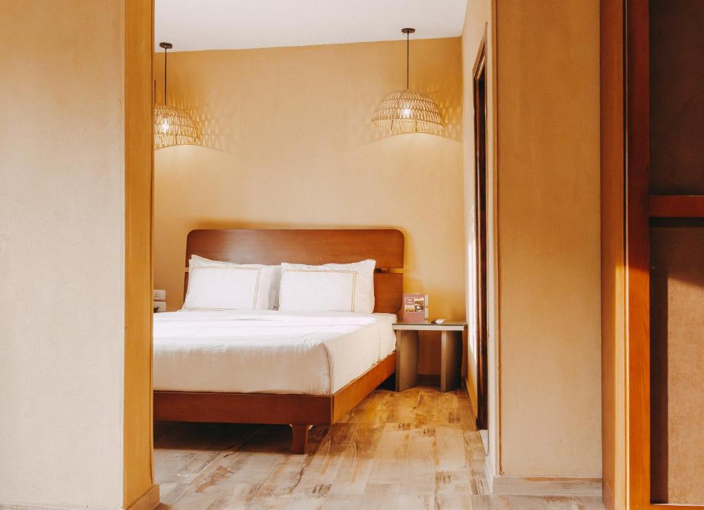 Postel nebo postele na pokoji v ubytování Almas Pyramids Hotel
