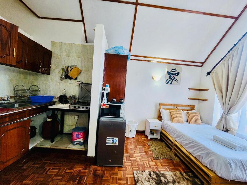 Η κουζίνα ή μικρή κουζίνα στο Rorot penthouse studio Kilimani home away