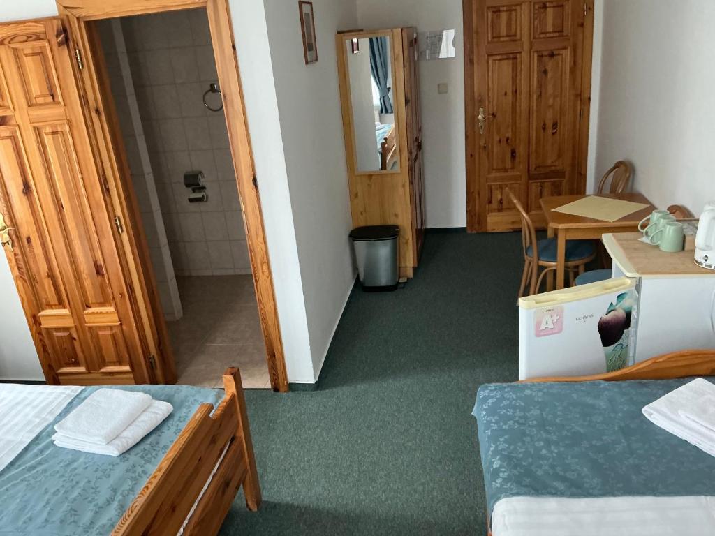 Postel nebo postele na pokoji v ubytování Pension Abbazia