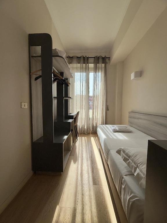 Postel nebo postele na pokoji v ubytování Hotel Laura
