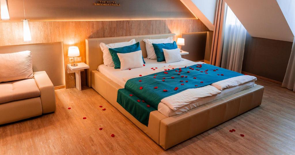 a bedroom with a large bed with roses on the floor at The Hotel Unforgettable - Hotel Tiliana by Homoky Hotels & Spa in Budapest