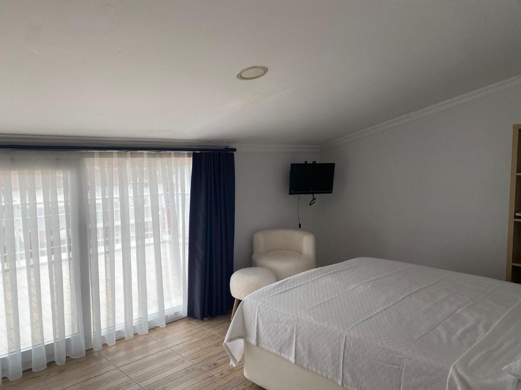Postel nebo postele na pokoji v ubytování Bouvardia Inn