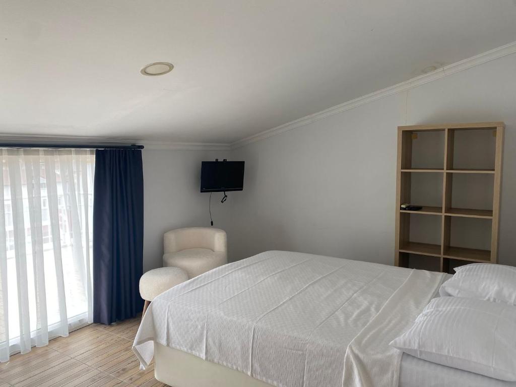 Postel nebo postele na pokoji v ubytování Bouvardia Inn