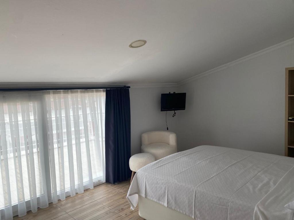 Postel nebo postele na pokoji v ubytování Bouvardia Inn