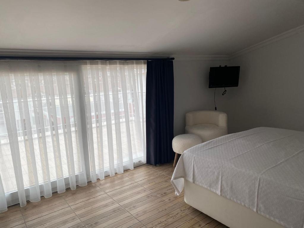 Postel nebo postele na pokoji v ubytování Bouvardia Inn