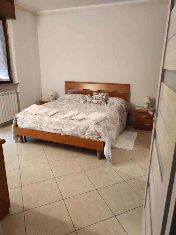 Postel nebo postele na pokoji v ubytování Spazioso appartamento su due piani