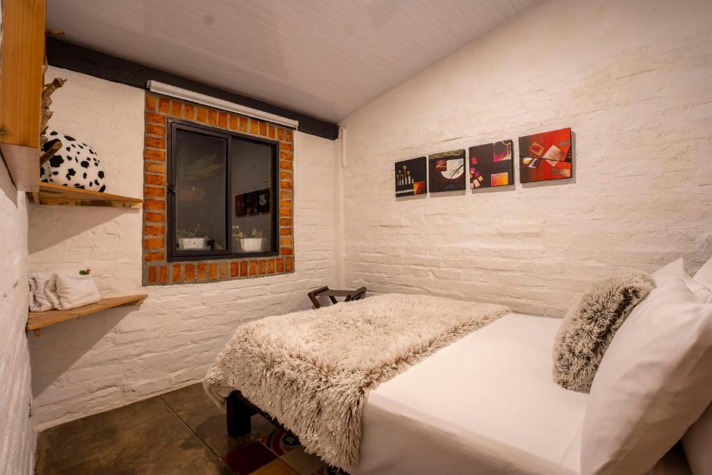 Postel nebo postele na pokoji v ubytování La Herradura lodge