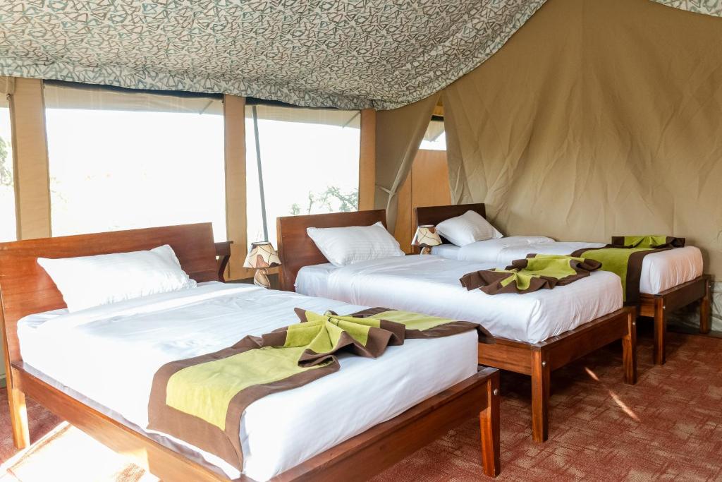 Postel nebo postele na pokoji v ubytování Mtito Safari camp limited