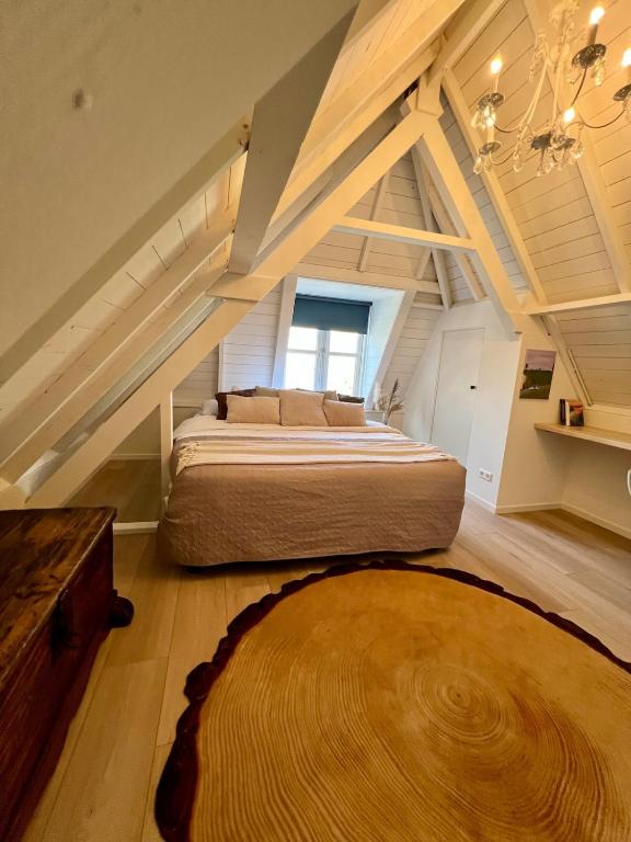 Postel nebo postele na pokoji v ubytování Rhynhoven Lodge