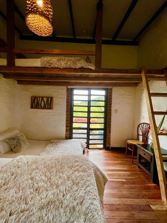 Postel nebo postele na pokoji v ubytování La Herradura lodge