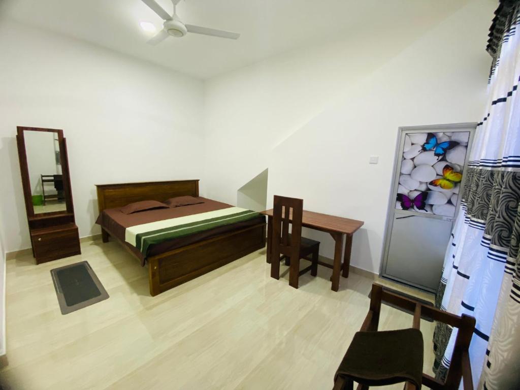 Postel nebo postele na pokoji v ubytování Mihitha Resort