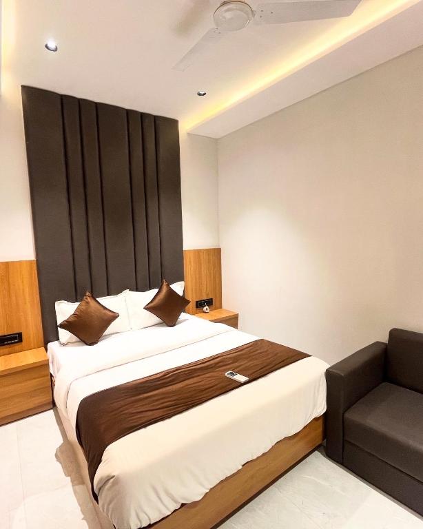 Postel nebo postele na pokoji v ubytování Hotel Pulse Town