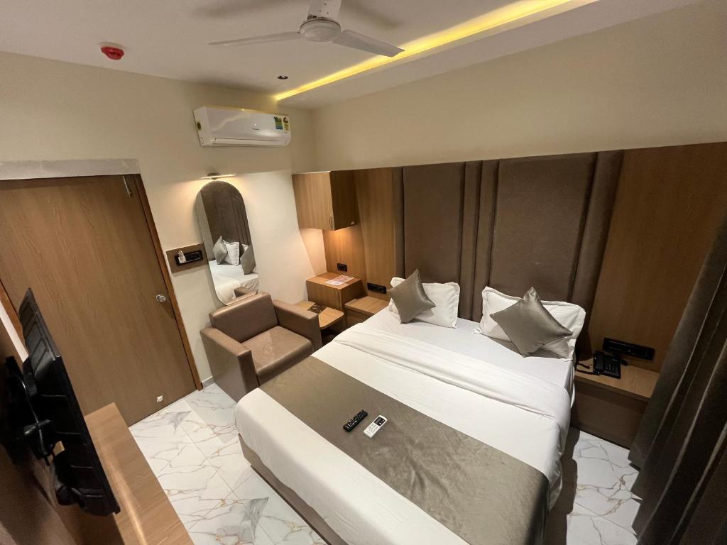 Postel nebo postele na pokoji v ubytování Hotel Pulse Town