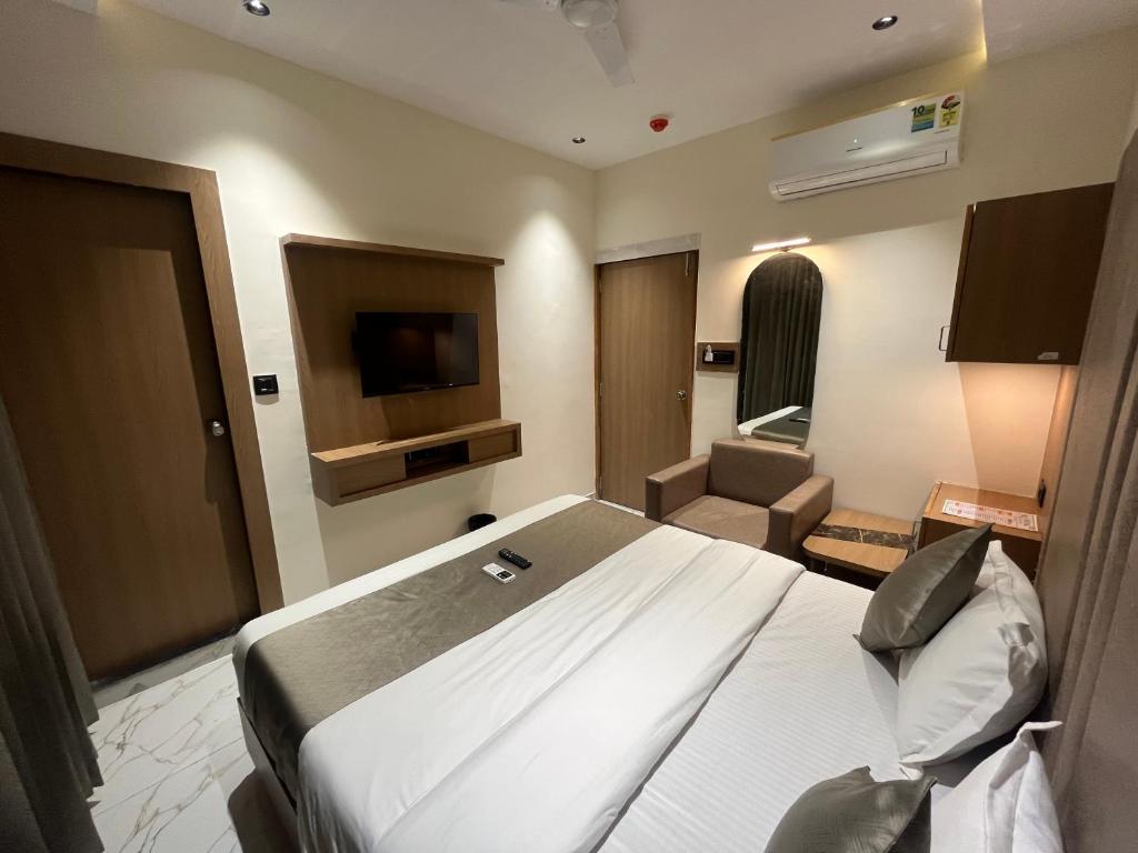 Postel nebo postele na pokoji v ubytování Hotel Pulse Town