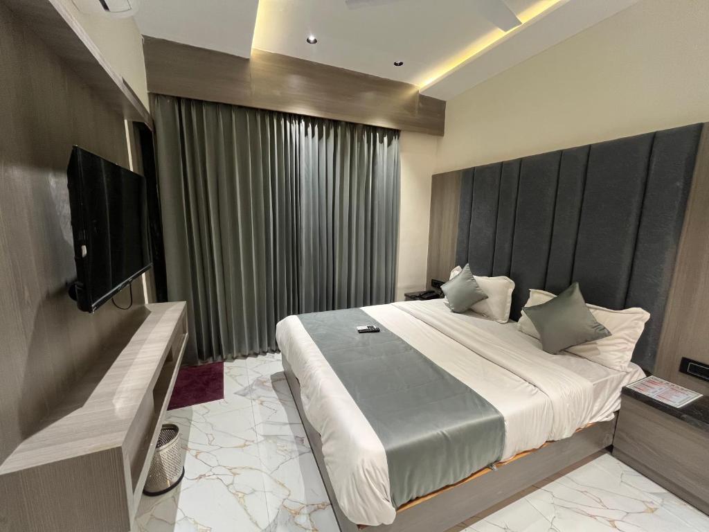 Postel nebo postele na pokoji v ubytování Hotel Pulse Town