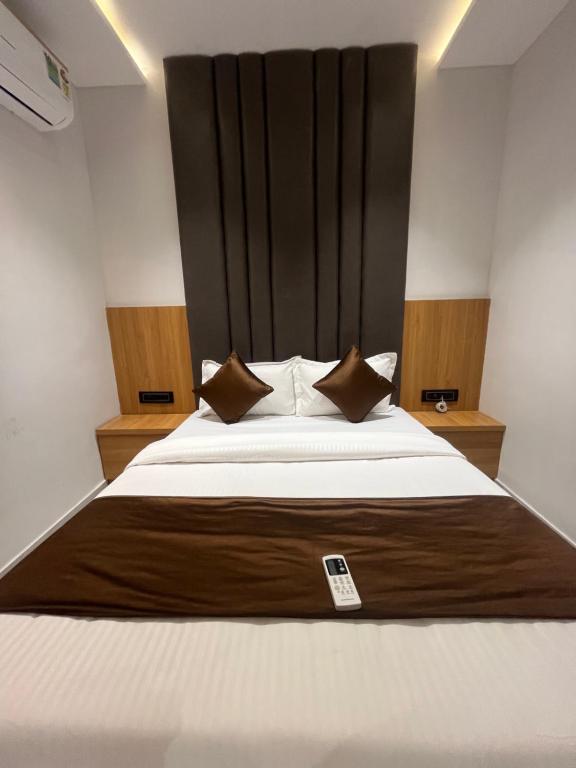 Postel nebo postele na pokoji v ubytování Hotel Pulse Town