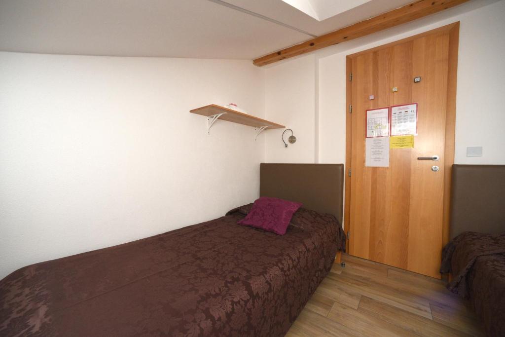 Postel nebo postele na pokoji v ubytování Fedrig Hostel rooms