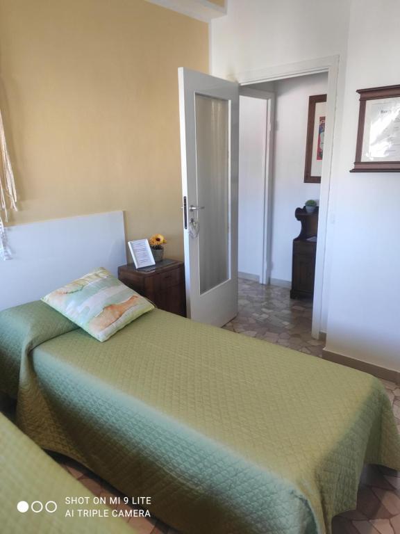 Postel nebo postele na pokoji v ubytování Casa di Ana