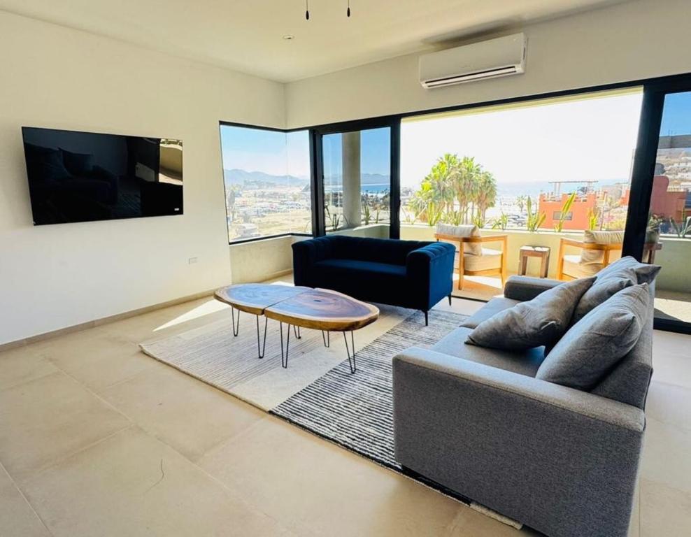 a living room with a couch and a table at Los Cerritos Oceanview at The Point,8 in San Carlos