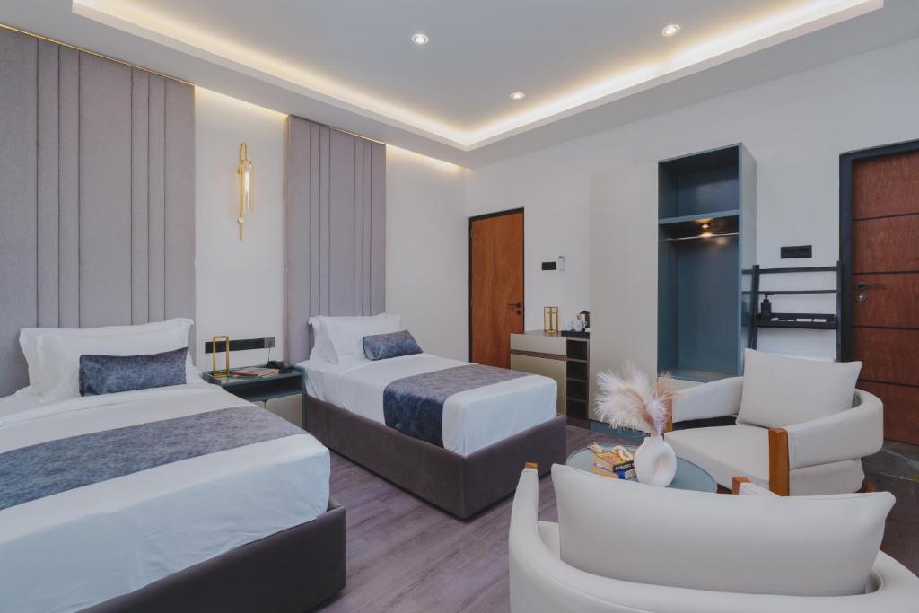 Postel nebo postele na pokoji v ubytování Orbit88 Hotel by AMR