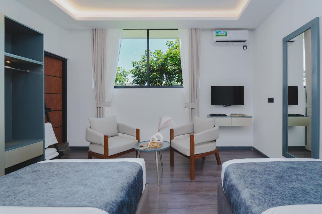 TV a/nebo společenská místnost v ubytování Orbit88 Hotel by AMR