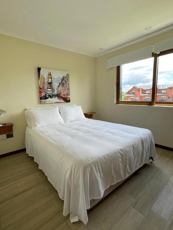 Postel nebo postele na pokoji v ubytování Apart Hotel Sol y Lago