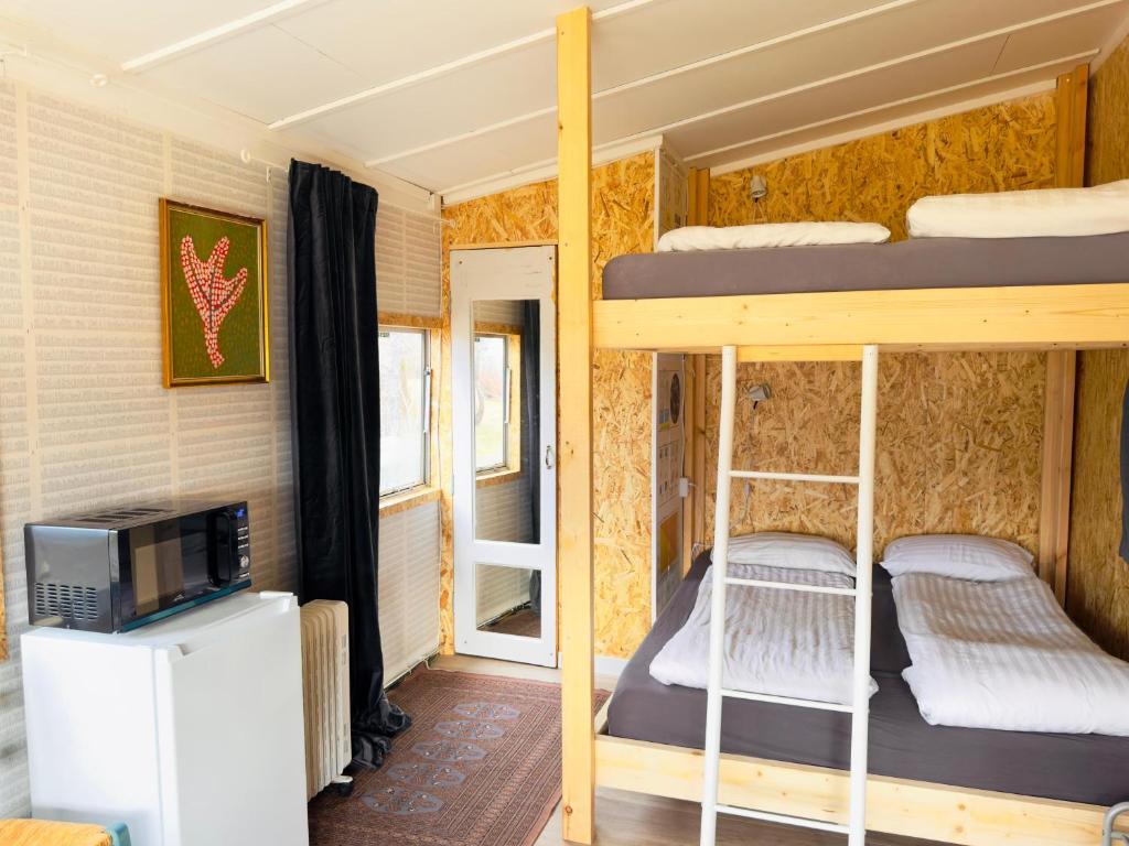 Postel nebo postele na pokoji v ubytování The Tiny House
