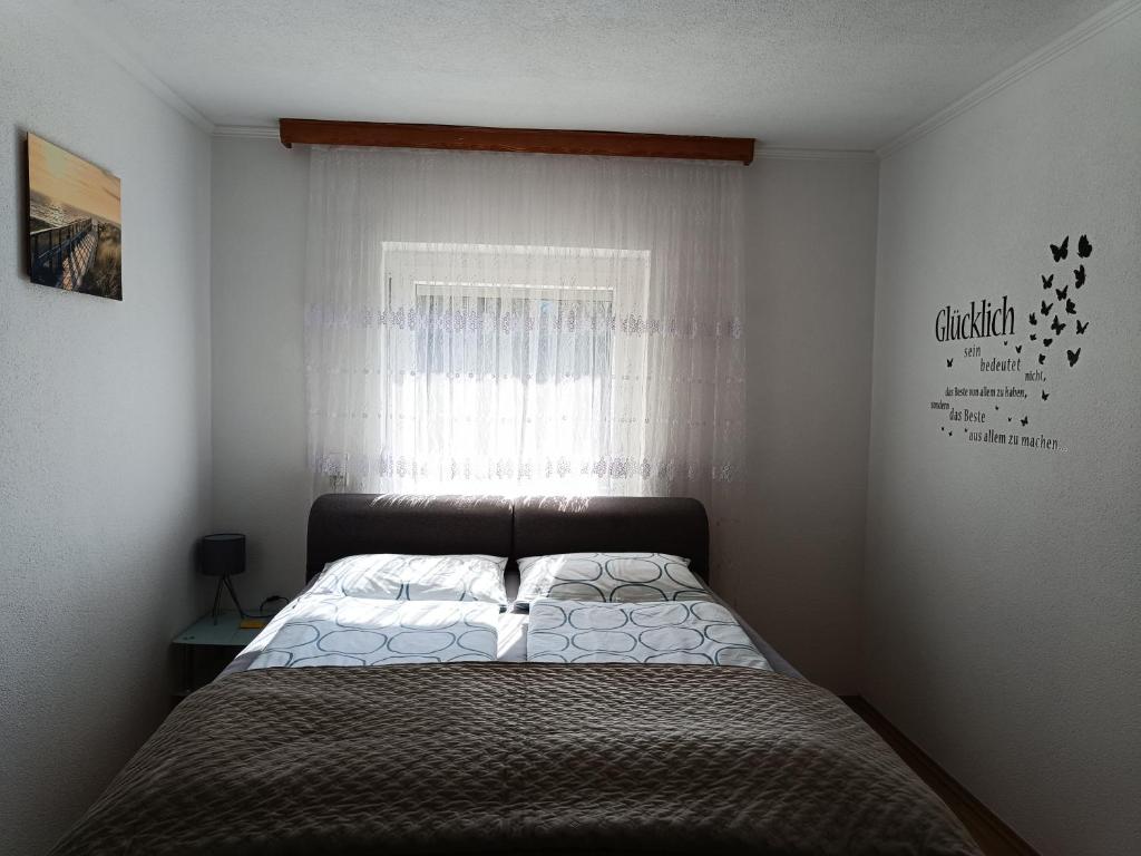 Letto o letti in una camera di Ella Ferienwohnung