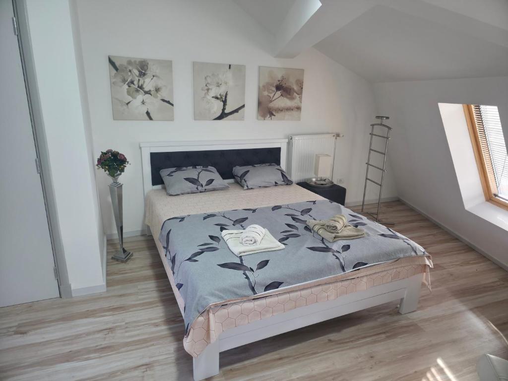 Postel nebo postele na pokoji v ubytování Fenix Apartments