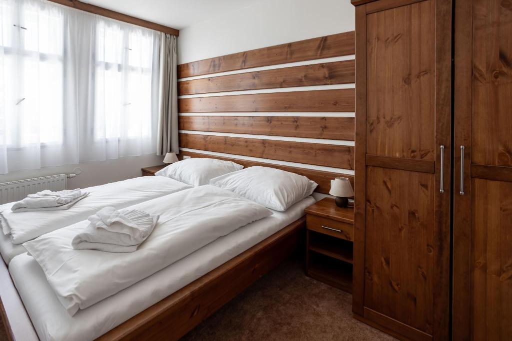Postel nebo postele na pokoji v ubytování Hotel Slavie