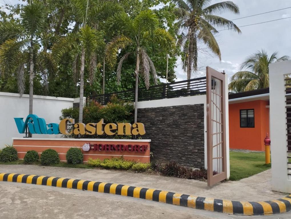 een bord voor een restaurant voor een gebouw bij Whole Furnished House with Parking and Sea View in Tagibo