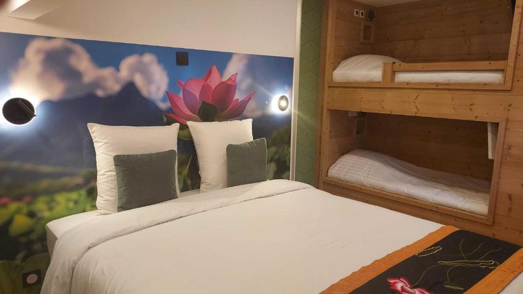 Postel nebo postele na pokoji v ubytování Le Lotus Blanc