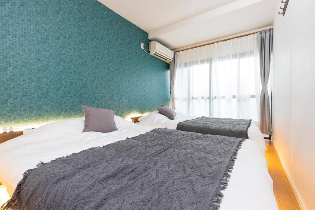 Zen Home AKABANEにあるベッド