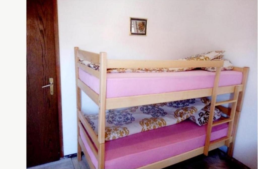 Postel nebo postele na pokoji v ubytování Bus Station Hostel