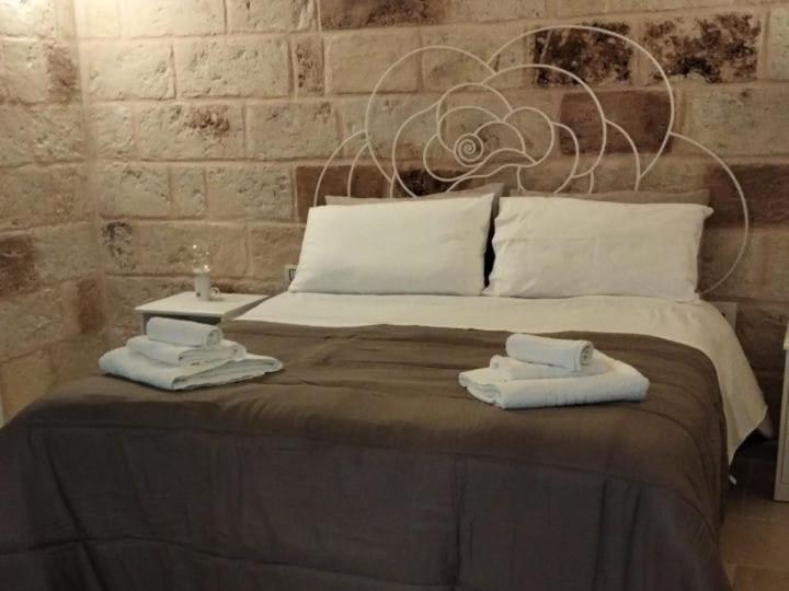 Ένα ή περισσότερα κρεβάτια σε δωμάτιο στο Perlage luxury room and wine