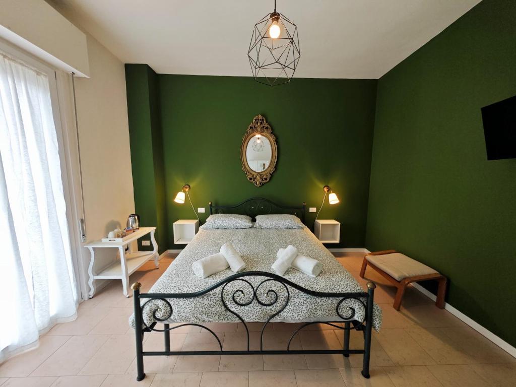 Postel nebo postele na pokoji v ubytování b&b il Melograno