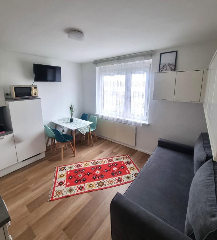 a living room with a couch and a table at RentinAustria in Reisenberg
